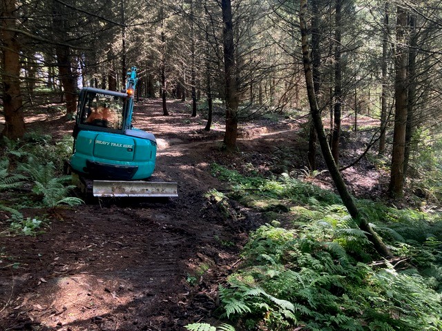 Forming the track with the digger.